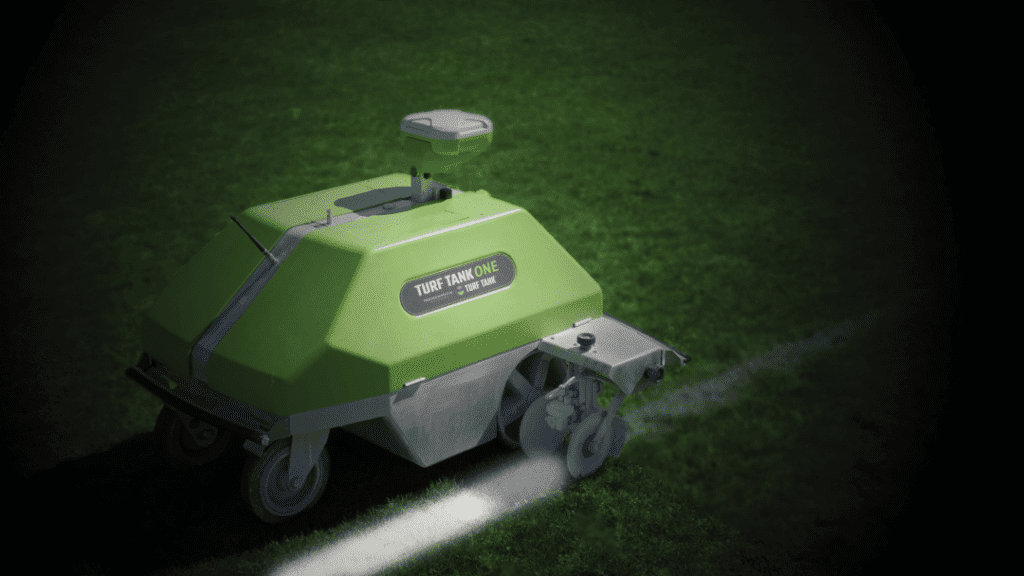 Turf Tank Robot painting a straight white line with a blurred frame