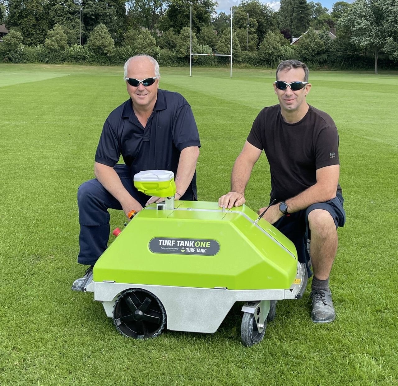 Aston university customers getting a picture with their Turf tank robot