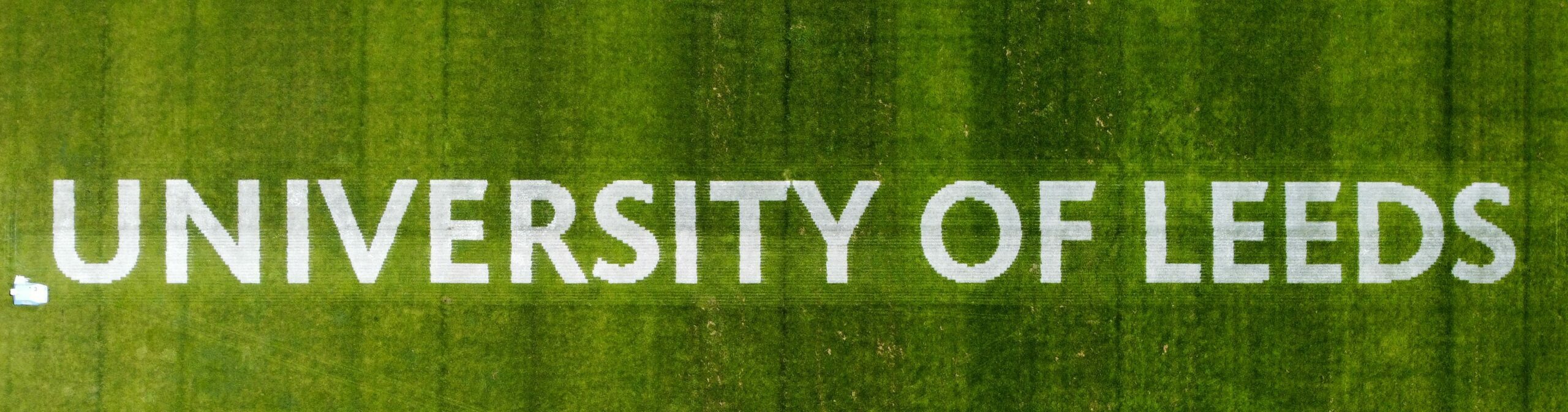 University of leeds text painted on grass