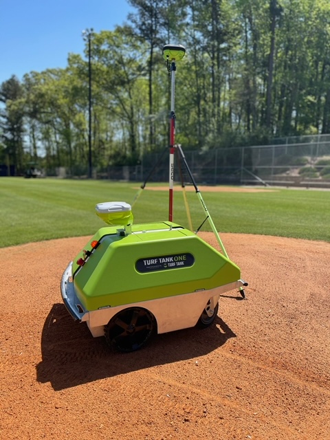 Turf tank robot and base station on baseball field