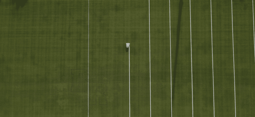 Autonomous Line Marking Robot Turf Tank painting 5-yard lines on a football field