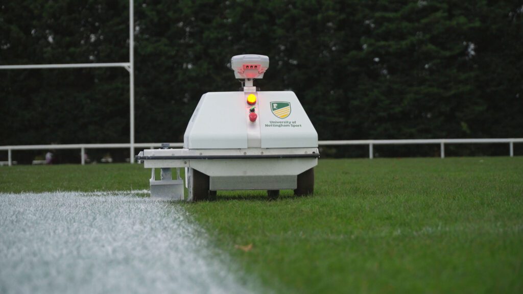Turf Tank one plus robot painting a logo on a natural grass field at University of Nottingham