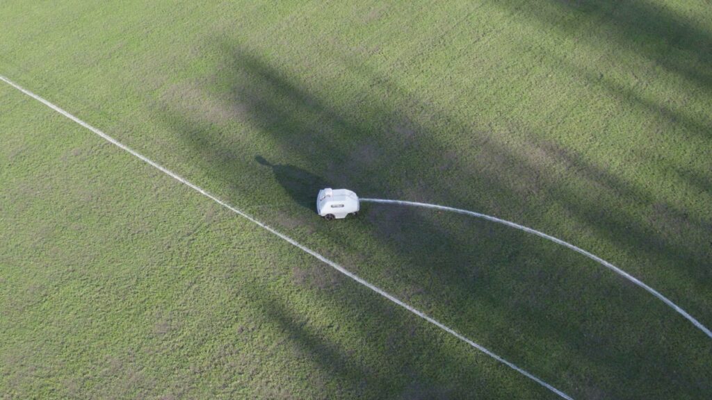 Worksop college's turf tank robot marking a soccer penalty box