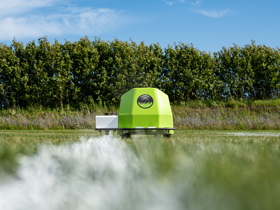Turf Tank Two robot painting a bright straight white line