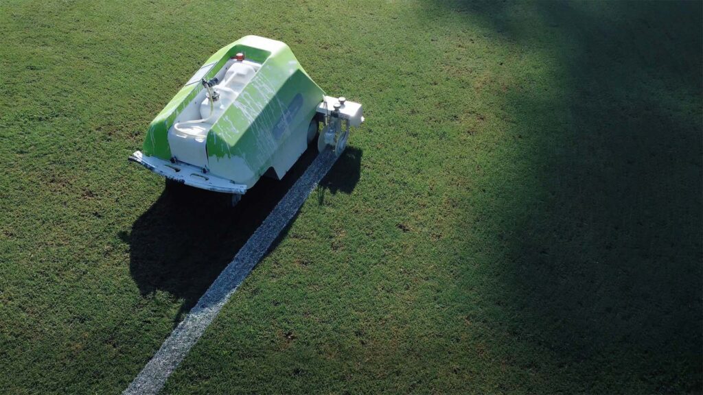 Turf Tank Two painting a line on a football field in Chattanooga